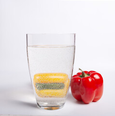 Fruits through the prism of a glass vessel with water.
On a white background.