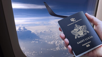 a hand holding saint Lucia passport on plane with plane wing and cloud, saint Lucia emblem