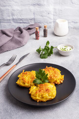 Fried cakes of grated potatoes on the plate with sauce. Traditional pancakes boxty raggmunk.