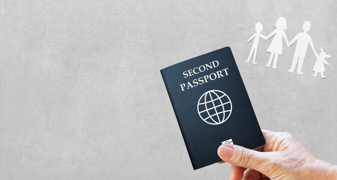hand holding second passport and  family icon on gray background