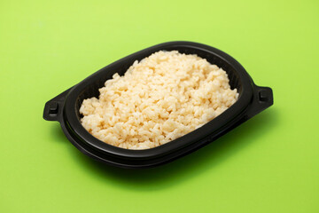 boiled rice in black plastic box