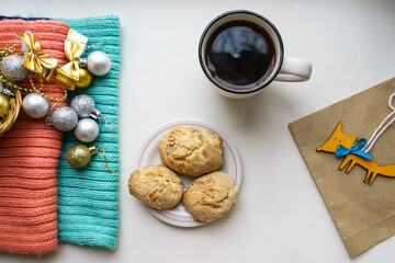 Christmas decorations, a cup of tea and homemade cookies on the windowsill