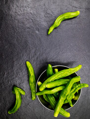 crumpled green peppers