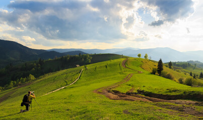 Photographers take pictures of spring rural landscape in the Mizhhiria, Carpathian mountains