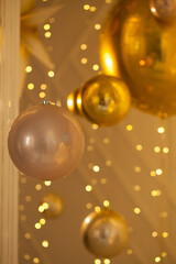 Fototapeta na wymiar Shiny golden decoration on abstract bokeh glitter sparkle light background