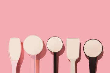 Measuring spoons with different collagen powder or protein. Beauty supplement for health and...