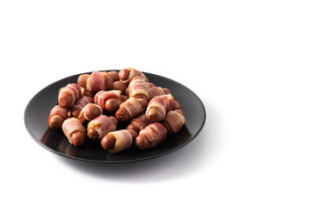Pig in blankets. Sausages wrapped in smoked bacon isolated on white background