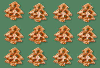 Christmas tree pattern. Green seamless background. Winter holidays ornament. Beige white gingerbread festive minimalistic symmetrical composition isolated on green mockup for design.