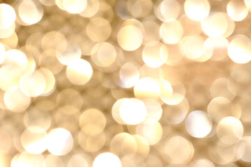 Shiny festive background. Gold color background. Blurred background