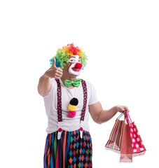 Funny clown with shopping bags isolated on white background