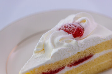 Close-up Japanese Strawberry Shortcake (Layer cake) on plate in elegant mood..