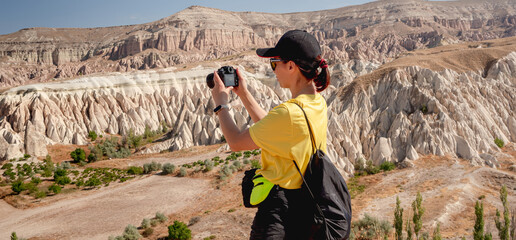 Tourist photographing landscape in Cappadocia