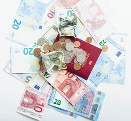 Cash on table isolated: dollars, euro, rubl broken money. All in mess, global crisis . passport travel concept