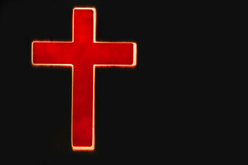 Silhouette of christian cross, lights, bokeh on black background. Copy space. Faith symbol. Church worship, salvation concept. Faith symbol in Jesus Christ. Holy cross for Easter day. Christianity