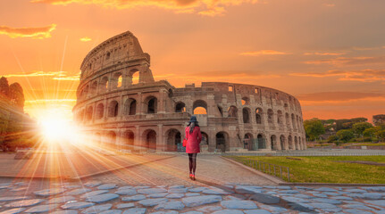 Fototapeta na wymiar Woman walking near Colosseum amphitheater in Rome