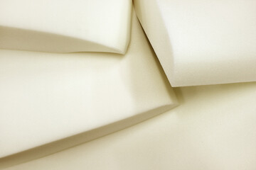 Foam rubber.Molded pieces of foam. Production of upholstered furniture, details. Close-up photos, selective focus.