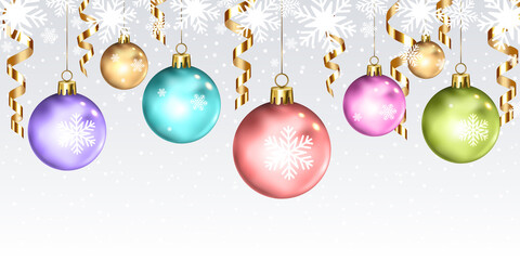 Christmas balls with gold ribbons on Christmas background with snowflakes.