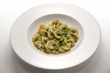 Orecchiette with turnip greens: orecchiette con cime di rapa, traditional homemade Italian pasta...