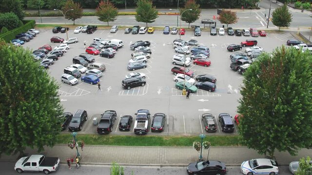 Time-lapse Shot Of Busy Parking Lot After Work.