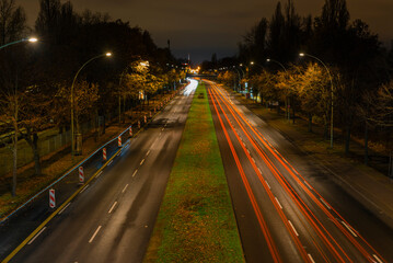 Light trails from cars on a street at night, a street at night in Berlin, Adlergestell in Berlin, Germany