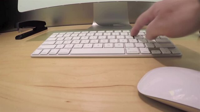 Man playing new apple computer inside Apple store with wide-angle camera shot