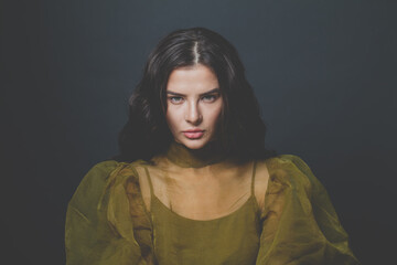 Glamorous woman brunette on black background