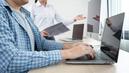 Asian Software engineer Programmer team working together on project of the System Coding New Application In IT Company Office