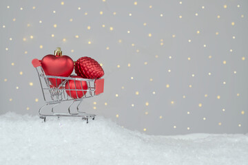 Purchase and delivery of gifts. Trolley with Christmas decorations. 