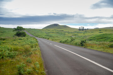 Straight and lonely road in the middle of Easter Island, Chile