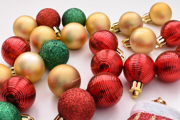 Christmas Golden, red and green ball on a white background. Copy space
