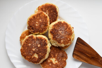 Cottage cheese pancakes on a white plate