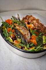 Mackerel grilled fish with vegetables in plate
