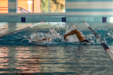Triathlon swimming. Triathletes training at the pool doing open water technique. triathlon drills