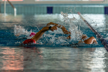 Triathlon swimming. Triathletes training at the pool doing open water technique. triathlon drills