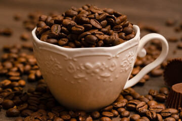 Coffee grains in a porcelain cup