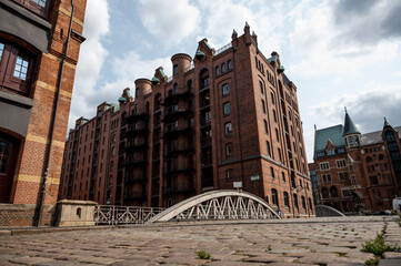 historic warehouse city in hamburg with river and riveted steel bridge