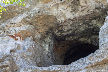 Ancient stone cave entrance outside view