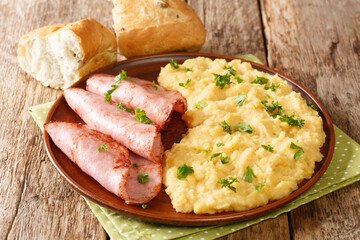 British dish is simply made using yellow split peas pease pudding serve this comforting side dish with ham closeup in the plate on the table. horizontal
