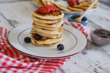 Delicious pancakes with blueberry and honey