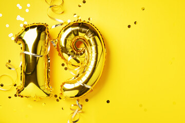 Gold foil balloon number, digit nineteen. Birthday greeting card, inscription 19. Anniversary...