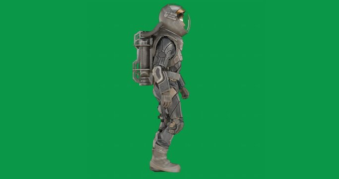 CHROMA KEY Astronaut in a spacesuit walking on against green screen. Space travel concept