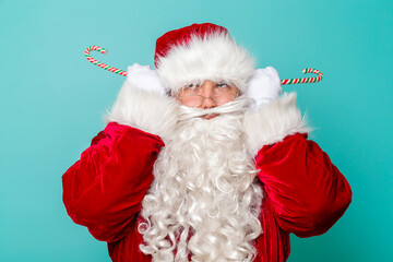Santa holding candy cane ears