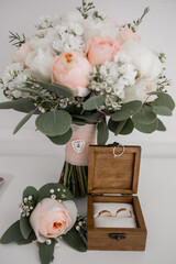wooden box for wedding rings with bridal bouquet