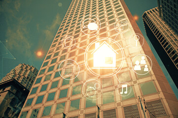 Double exposure of buildings hologram over cityscape background. Concept of smart city.