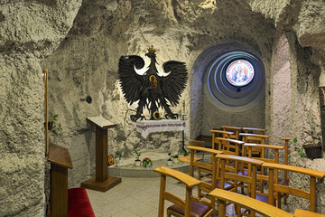 Budapest, Hungary. The chapel of Our Lady of Czestochowa with Poland heraldic eagle and icon of Black Madonna in the Cave Church in the Gellert Hill Cave.