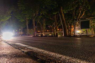 A long exposure shot of a car driving at night