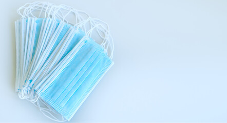 Surgical mask with rubber ear straps. protective mask from bacteria and virus infection. Coronavirus and flu virus protection concept. Banner with free space