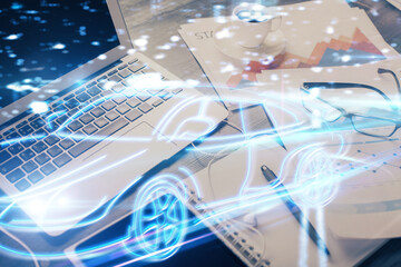 Desktop computer background in office with automobile hologram drawing. Multi exposure. Tech concept.