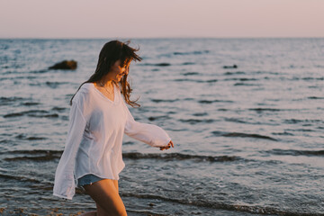 Fototapeta na wymiar Carefree woman on the beach. Freedom. lifestyle concepts