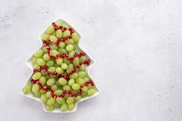 Christmas tree fruit salad with grapes and pomegranate